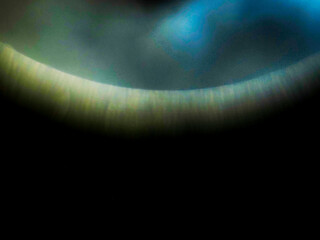 Colorful light leak on dark background. Cinematic visual lens effect for design and creative ideas. Abstract wall paper.