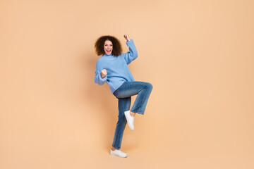 Photo of young brown hair chevelure lady in blue sweater and jeans clothes brand advertisement isolated on beige color background