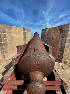 Close up of a cannon on the City Walls of Mazagan in El Jadida, Morocco at sunset. The City Wall around the old city. It is a Portuguese Fortified Port City registered as a UNESCO World Heritage