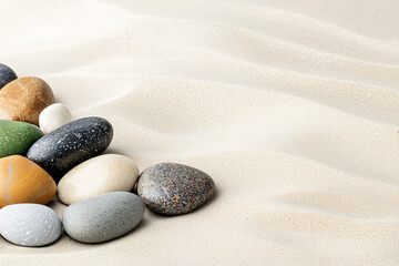 colorful stones scattered on a sandy beach, capturing their unique textures