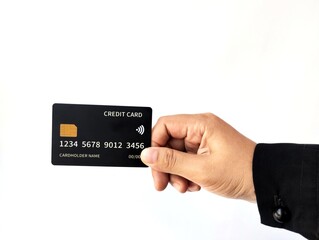 Hand Holding Black Credit Card isolated on white background 