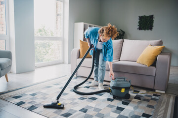 Full length photo of lovely young ginger girl stressed repair vacuum cleaner confused dressed blue...