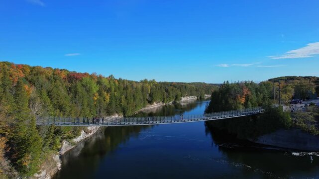 Aerial view from above at Ranney Gorge Suspension Bridge in Campbellford, part of the Great Trail. Longest recreational trail in the world. Trent River below and Ranney Falls to the north. Ferris Park