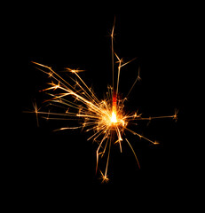 Christmas sparkler burning isolated on black background...