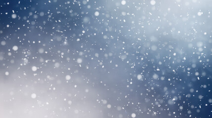 Obraz premium A serene winter wonderland featuring softly falling snowflakes against a gradient of blue tones, creating a tranquil and magical atmosphere.