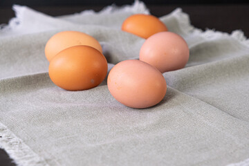 Brown eggs on gray napkin