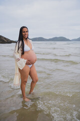 a pregnant woman on the beach