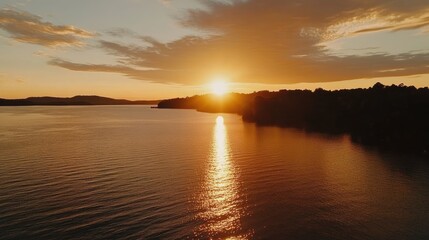 Obraz premium Serene Sunset Over Tranquil Water Landscape