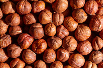 Scattered Peeled Hazelnut - Top View. Background from Hazelnuts. Natural High-Calorie Snacks