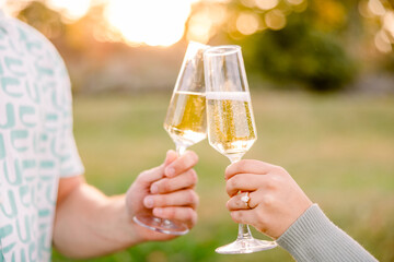 champagne toast outside at sunset