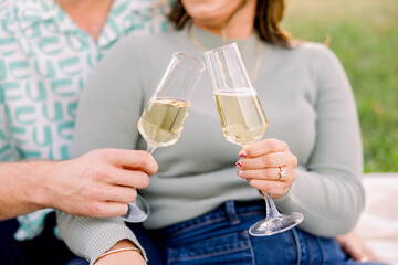 champagne toast outside at sunset