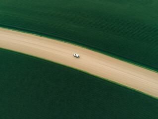 Aerial shot of the car driving through a road. High quality photo