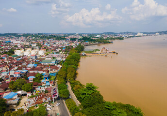 Densely populated area on the banks of the Mahakam River in Samarinda City, East Kalimantan, Indonesia, seen from an aerial view. Samarinda is a business city in East Kalimantan.