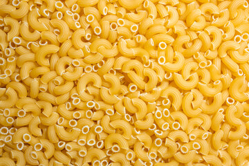 Uncooked Chifferi Rigati Pasta: A Culinary Canvas of Chifferi Rigati, Creating a Lively and Textured Background for Gourmet Cooking. Dry Pasta. Raw Macaroni - Top View, Flat Lay