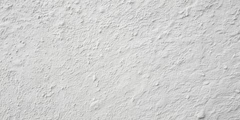 Fototapeta premium A textured white wall with an uneven, grainy surface, ideal for backgrounds and design elements.