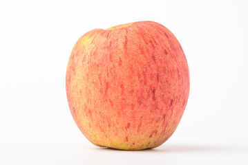 Fototapeta premium Fresh ripe apple with tiny water drops on white background