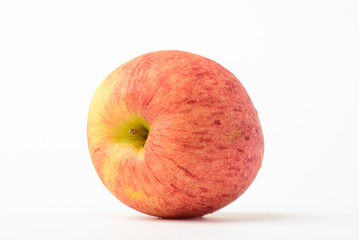 Fresh ripe apple with tiny water drops on white background