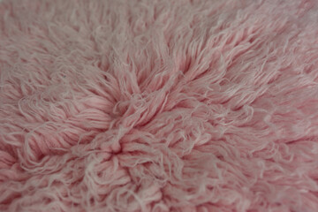 close up of pink fluffy carpet. sheepskin fur © Svetlana