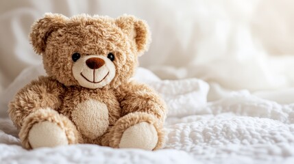 Obraz premium A small brown teddy bear sitting quietly, its soft fur and gentle smile creating a warm and comforting scene against a clean, light background