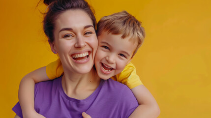 Happy young man�portrait of a handsome young man in a casual shirt with arms crossed and smiling against a grey background