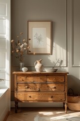 Modern minimalist interior with wooden sideboard and poster frame