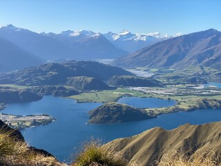 Beautiful landscapes of Lake Wanaka from Mount Roy, Roys Peak, Wanaka, South Island, New Zealand. Landscape with mountains and sky