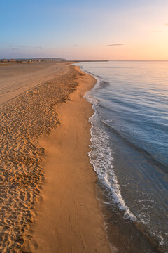 Beach During Sunrise. Colorful Beach Sunrise, Blue Sea Water On Sunny Days. Sunrise Over The Mediterranean Sea In Beach In The Resort Town Of Leucate, Located In France.