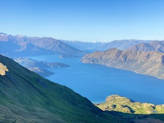 Beautiful landscapes of Lake Wanaka from Mount Roy, Roys Peak, Wanaka, South Island, New Zealand. Landscape with mountains and sky