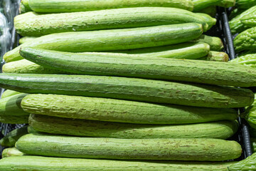 Fresh green sponge gourd or luffa in the market.