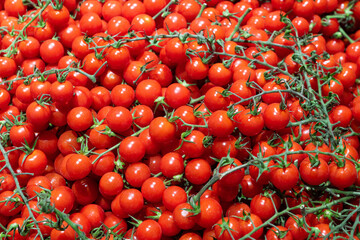 delicious ripe red cherry tomatoes background.