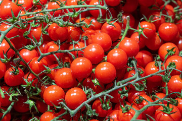 delicious ripe red cherry tomatoes background.