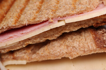ham and cheese sandwich. sandwich with ham and cheese. sandwich with selective focus. food background,