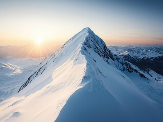 A stunning peak crowned with snow, illuminated by a golden sunrise, surrounded by expansive mountain landscapes.