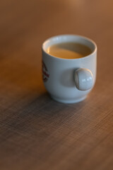 Small coffee in a white mug.
