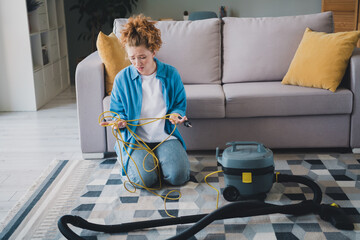 Full size photo of attractive young redhair woman stressed repair vacuum cleaner dressed blue...