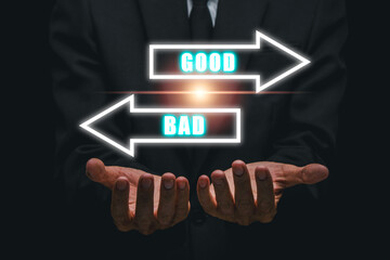 Visual representation of decision-making with glowing arrows labeled 'Good' and 'Bad' in a business setting.