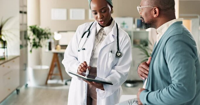 Tablet, discussion and doctor with black man in checkup at hospital for diagnosis or treatment plan. Technology, healthcare and patient with medical worker for cardiovascular consultation in clinic.