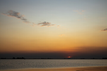 Beautiful sunset at sea. With orange clouds.
