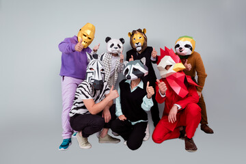 Full size photo of zebra gorilla raccoon lion panda sloth rooster mask people demonstrate thumb up...