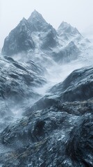 Obraz premium Majestic Snowy Mountain Range in Foggy Landscape