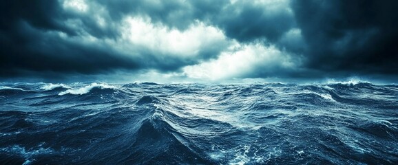 Dramatic stormy seascape with dark, foreboding clouds above.