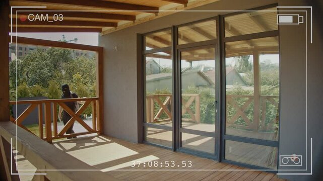 Surveillance Footage Captures Armed Burglars in Masks Forcing Their Way Into a Home and Then Fleeing. Importance of Advanced Home Security Systems and Real-Time Monitoring to Deter Criminal Activity.
