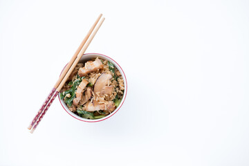 a bowl of Chinese Mustard Green Rice on white background. This bowl of mustard green rice consists of pork belly, dried prawns and mustard greens