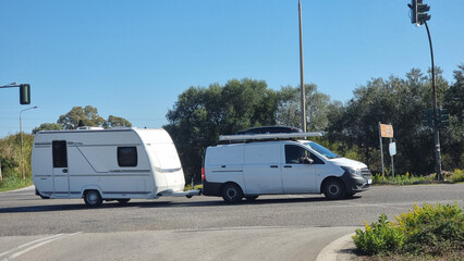 trailer caravan moving on the road in autumn season