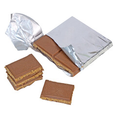 Milk chocolate bar wrapped in foil filled with cookie dough caramel butter nuts filling with pieces stacked isolated on white background
