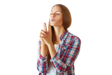 Young woman in plaid shirt making finger gun gesture, isolated on white background. Concept of playfulness and creativity