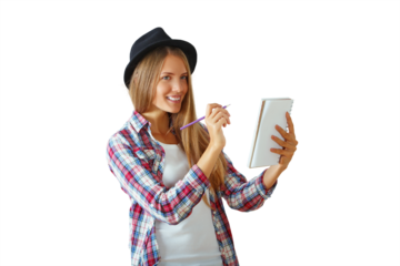 Smiling woman in plaid shirt and hat holds a notebook and pen. Isolated on white background. Concept of creativity and planning
