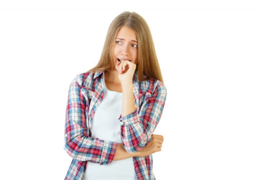 Young woman biting nails, wearing plaid shirt, isolated on white background, expressing anxiety. Concept of worry and stress - Powered by Adobe