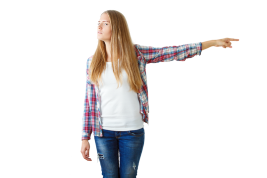 Woman in casual attire pointing to the right, isolated on white background. Concept of direction, decision, or guidance