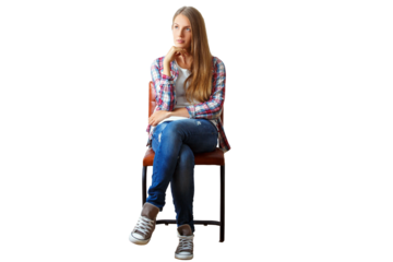 Woman seated on a chair, wearing casual clothes, isolated on a white background. Concept of contemplation and casual style
